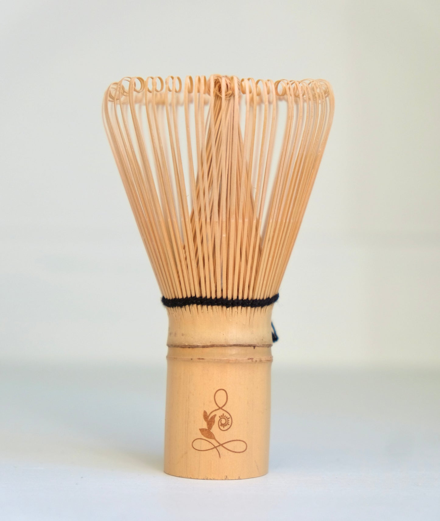 Bamboo whisk with a logo on a white background